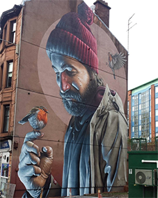 Muurschildering van Smug in Glasgow met man en roodborstje